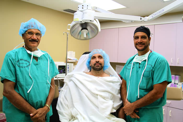 Dr. Mohan Desarda observing patient with Dr. Robert Tomas
